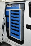 Metal drawers on the Nissan NV200 accessible from the side door