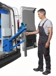 Operator folding up the FORTIX fold-away vice bench