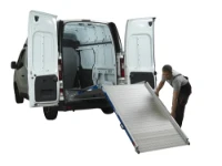 Operator positioning the foldable aluminium loading ramp