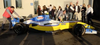 Outside the new HQ in Via Portile: an exhibition of racing cars