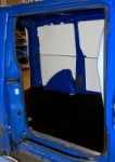 Painted steel panels on the van’s left side wall