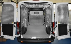 Panelling and bulkhead lining in chequer-plate aluminium and wooden floor panel for the Transit