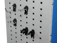 Plastic and steel hooks and clips on a racking side panel