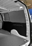 Pre-painted sheet-metal lining and marble-finish plywood for the Berlingo
