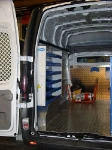 Lato sinistro Opel Movano con pianale, pannellatura, copriruota, ganci e rotaia per cinghie