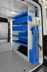 03_The right of the Transit, showing the vice bench and shelves of plastic containers