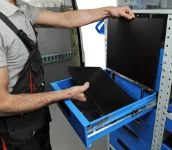 22_The board lifts to provide access to the drawer