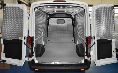 A good example of a Ford Transit with a floor liner in marble-look plywood and bodywork liners in aluminium chequer plate