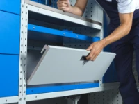 A lift-and-rotate door for enclosing the space around the wheel arch