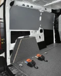 A milled rail recessed in a floor liner, with reel tensioners