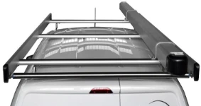 A pipe carrier on the roof of a Ford Courier