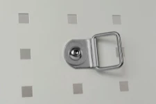 A steel swivel ring fixed to a bodywork liner