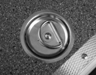 A steel swivel ring in a floor liner