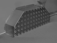 A wheel arch liner in steel and aluminium chequer plate