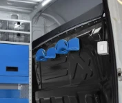 Aluminium cable holders on a van’s bulkhead