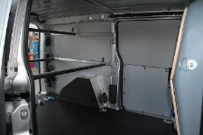 Expert cargo interior with protective linings and load bar system