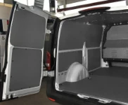 Floor and bulkhead liners in marble-look plywood and steel sheet bodywork liners in the Vito