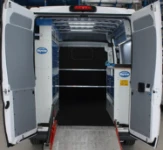 Racking in a van used to transport industrial cleaning machines