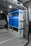 Right-side shelving with metal drawers and shelves with dividers in the Ford Custom