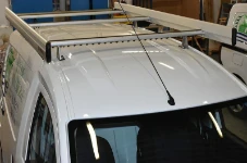 Roof rack with side rails, roller and Ultrasilent profile on the roof of the Dokker