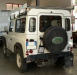 Roof racking system with roller and side stops Defender