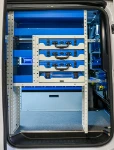 Shelving on the side door of the Vivaro with cases and shelves