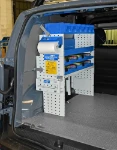 Shelving with case retainer, plastic cases, shelf and containers in the Citan