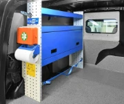 Shelving with first-aid kit, paper roll holder and drawer on pegboard in the Dokker