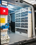 Shelving with pull-out transparent drawers in the Talento with floor panel and panelling