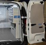 Shelving with small parts in transparent containers and a drawer in the Dokker