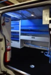 Storage units in a van used to service and repair vehicle washing systems