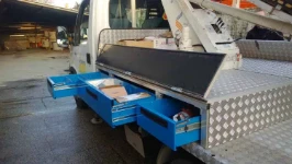 Sub-floorboard drawer units on a truck with aerial lift
