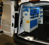 Syncro storage modules along one side of a van used by cable installers