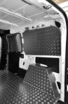 The Doblò’s interior lined in aluminium tread plate