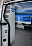 The racking system for a plumbing service, seen through the Partner’s side door