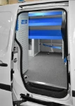 View from the NV250's side door showing the Syncro Ultra module and load-restraint bar